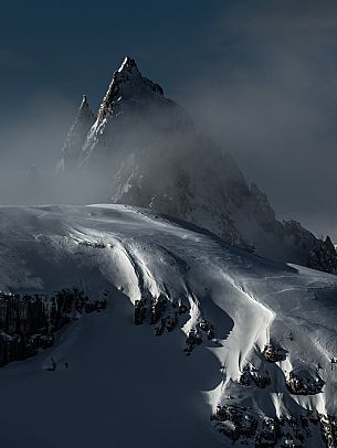 Detail of the Cadini di Misurina in winter during a cloudy dawn, Tre Cime natural park, dolomites, Auronzo, Veneto, Italy