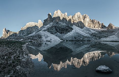 Pale di San Martino reflected in the Pradidali lake at the first light of day, dolomites, Trentino Alto Adige, Italy, Europe