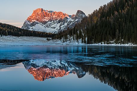 Pale di San Martino at sunset during the enrosadira reflected in the Calaita lake, dolomites, Trentino Alto Adige, Italy, Europe