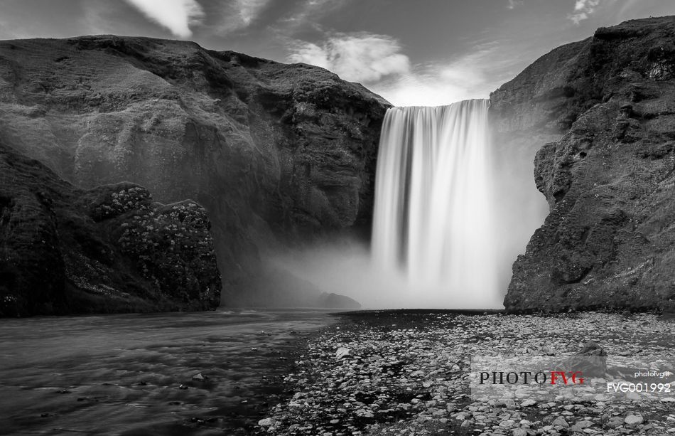 A black and white view of Skgafoss waterfall