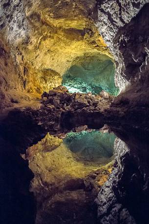 A small lake inside the volcanic cave: Cueva de los Verdes.