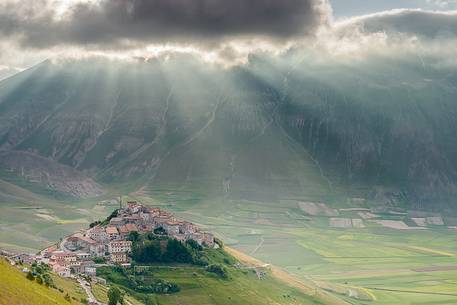 Morning view of Castelluccio, Piano Grande and Monte Vettore under a big cloud