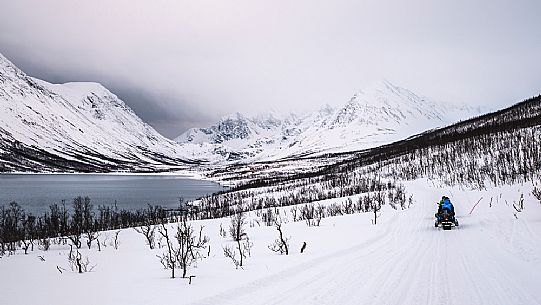 Snowmobile trip in the Lyngen Alps, Troms, Norway, Europe 
