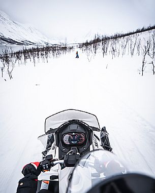 Snowmobile trip in the Lyngen Alps, Troms, Norway, Europe 
