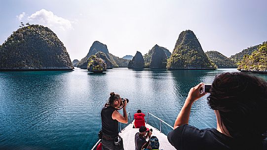 Boat trip in the tropical beauty of Wayag Island, one of the Raja Ampat archipelago, West Papua, New Guinea, Indonesia. 