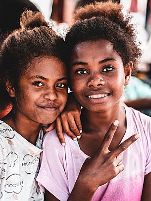 Portrait of a couple of indigenous sisters in the village of of Sauwandarek in the Raja Ampat archipelago, West Papua, Indonesia