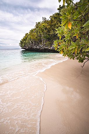 Hidden beach located at Pulau Friwenbonda, a small island of Raja Ampat Archipelago, West Papua, Indonesia