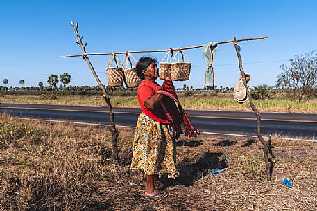 Indigenous woman sells handicrafts on the street, Paraguay, America