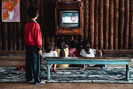 Children distracted by television in a elementary school in the Paraguayan Chaco, Paraguay, America