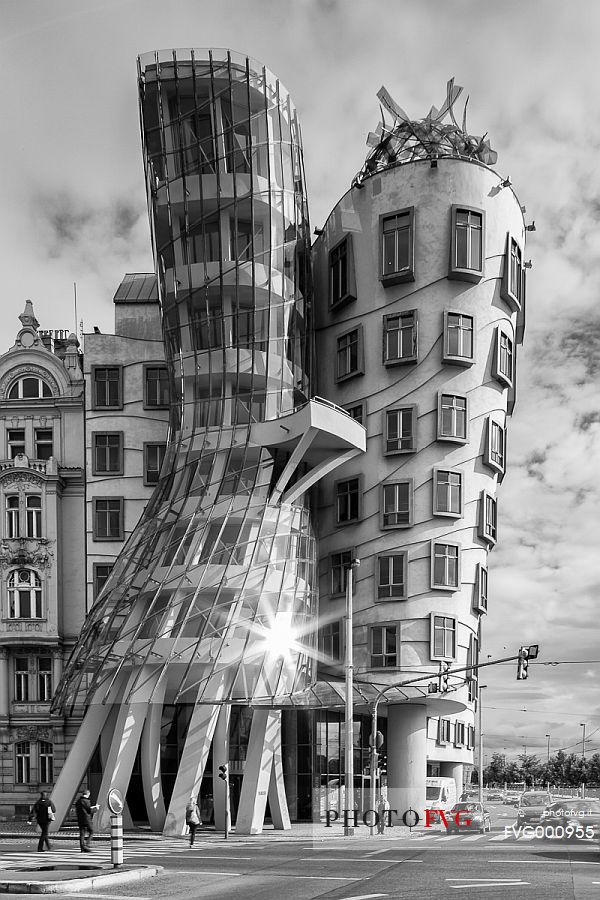 A light reflection on the modern building called Tancici Dum, or Ginger and Fred, designed by Frank Gehry A light reflection on the modern building called Tancici Dum, or Ginger and Fred, designed by Frank Gehry