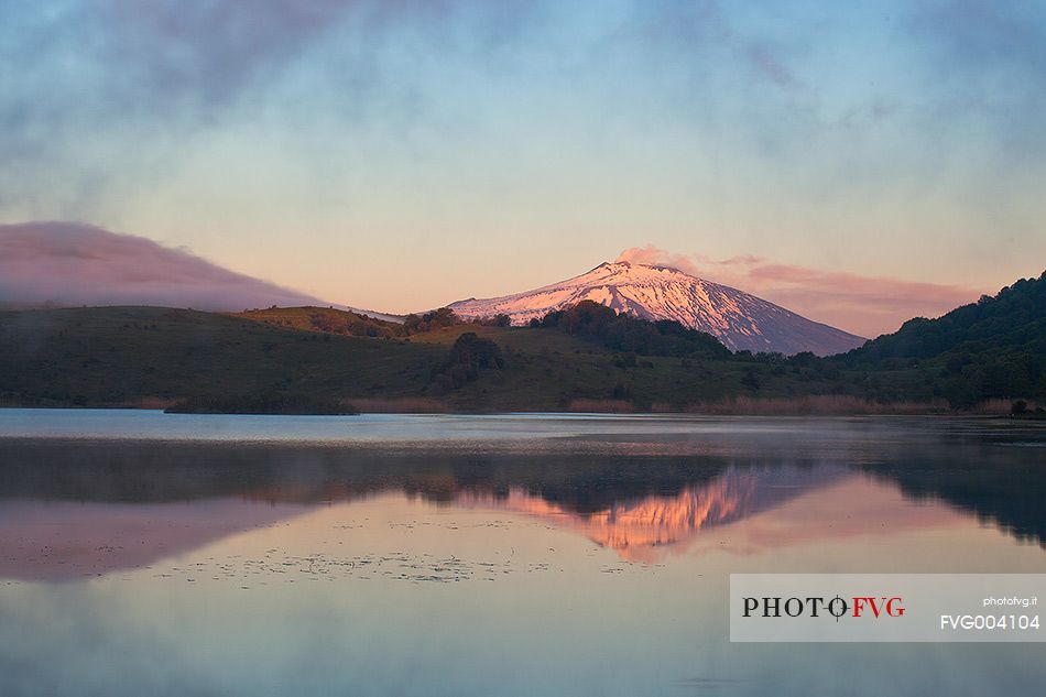 Etna is reflected on the lake Biviere