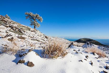 First snowfall of Monte Nero degli Zappini, in the background the crater of Mount Vetore