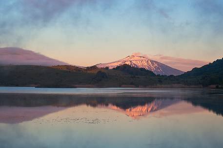 Etna is reflected on the lake Biviere