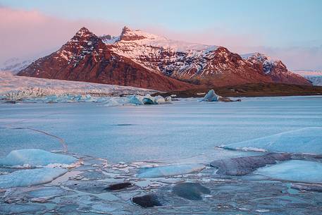 First lights of dawn in a glacier lagoon