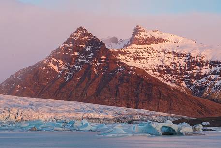 First lights of dawn in a glacier lagoon