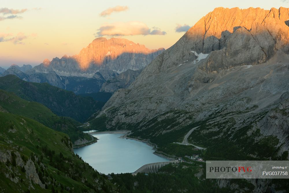 Marmolada mount and Fedaia lake from above, in the backgroundi the Civetta peak, dolomites, Italy, Europe