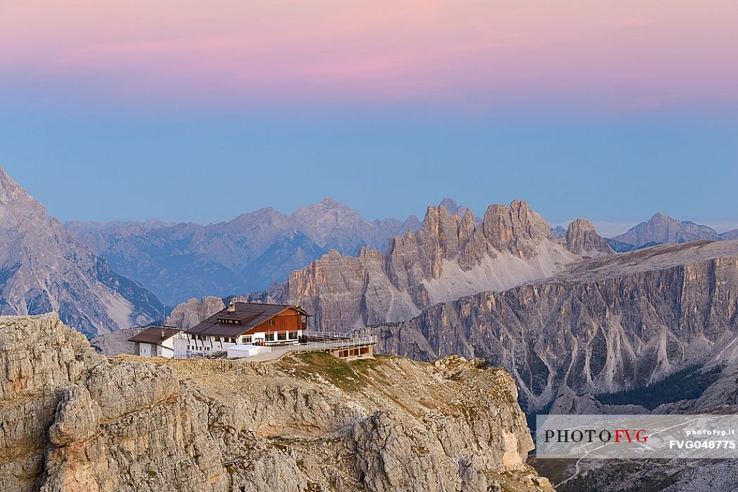 Views from Mount Lagazuoi with the first intense autumn lights, in the background the Lagazuoi refuge and Croda da Lago mount, dolomites, Veneto, Italy, Europe.