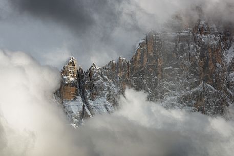 The north-west wall of the Civetta mount wrapped in stormy cloud, dolomites, Italy