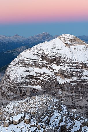 Dawn from the top of Tofana di Mezzo (3244 m) towards Tofana di Rozes after a slight summer snowfall, Cortina d'Ampezzo, dolomites, Italy