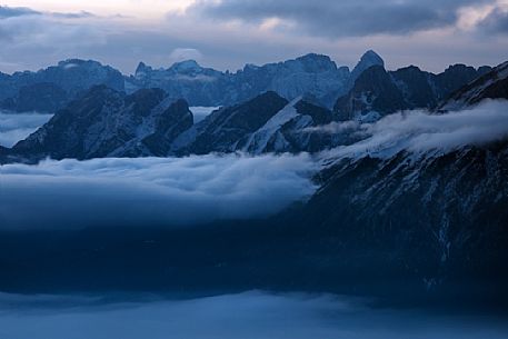 Unexpected views from the Alpago to the Pale di San Martino group and Mount Agner, dolomites, Veneto, Italy