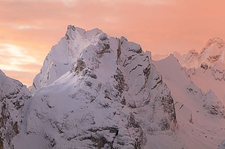 After a heavy snowfall on a cold winter morning, sunrise from Misurina towards the Marmarole mountain group.
At sunrise the Marmarole are wrapped in a pink-colored snow storm, dolomites, Auronzo, Veneto, Italy, Europe