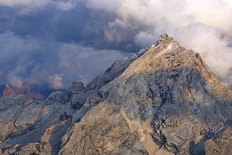 Monte Antelao peak at sunset in the storm from the top of Tofana di Mezzo, Cortina d'Ampezzo, dolomites, Italy.