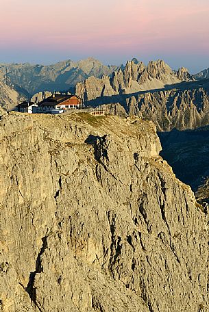 Views from Mount Lagazuoi with the first intense autumn lights, in the background the Lagazuoi refuge and Croda da Lago mount, dolomites, Veneto, Italy, Europe.