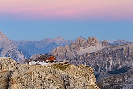 Views from Mount Lagazuoi with the first intense autumn lights, in the background the Lagazuoi refuge and Croda da Lago mount, dolomites, Veneto, Italy, Europe.