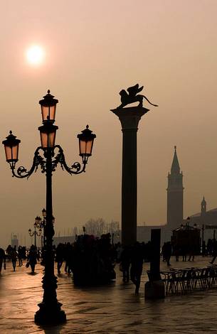 Tourists in Saint mark square with bell tower in the foggy day, Venice, Veneto, Italy, Europe