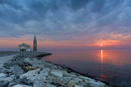 Seascape of Caorle, in the background the Santuario della Madonna dell'Angelo in background, venetian lagoon, Veneto, Italy, Europe
