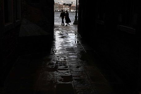 Pair in silhouette after the storm at the Zattere in front of the Giudecca, Venice, Veneto, Italy, Europe