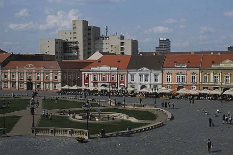 Piata Unirii square, with the mineral water fountain and the monument to the Holy Trinity in the foreground seen from the Museum of Art, Timisoara, Romania, Europe