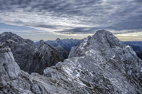 Along the safeguarded climb Ceria Merlone from the top of the Foronon del Buinz towards the Medeon del Buinz in the Montasio group, Julian alps, Friuli Venezia Giulia, Italy, Europe