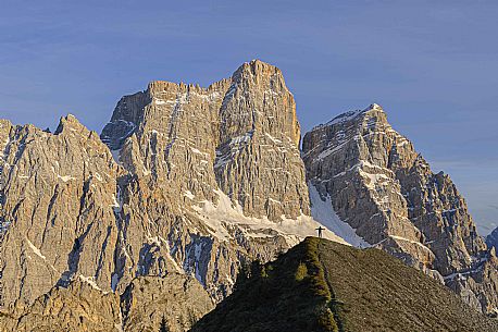 Hiker in front of the west face of the Pelmo peak, Veneto, dolomites, Italy, Europe