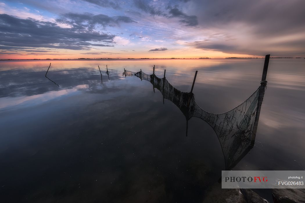 Fish nets in the Grado lagoon at sunset, Friuli Venezia Giulia, Italy