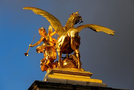 Golden horse statue at Alexander III Bridge. Paris, France