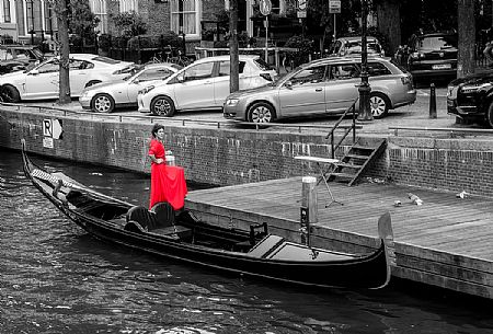 The woman in red and her gondola, Amsterdam, Holland