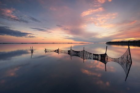 Fish nets in the Grado lagoon at sunset, Friuli Venezia Giulia, Italy