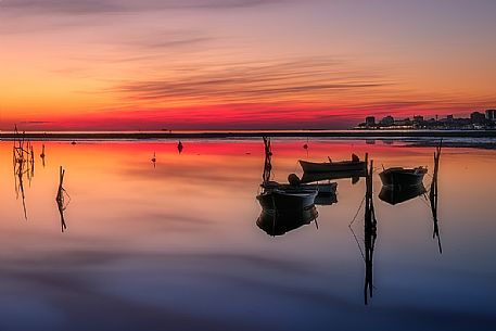 Boats in the red sunset, Grado, Italy