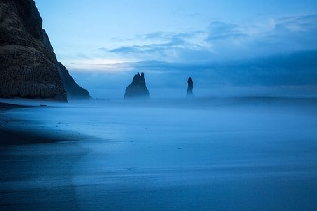 Volcanic rock formations at the sunset, Vik beach, Iceland