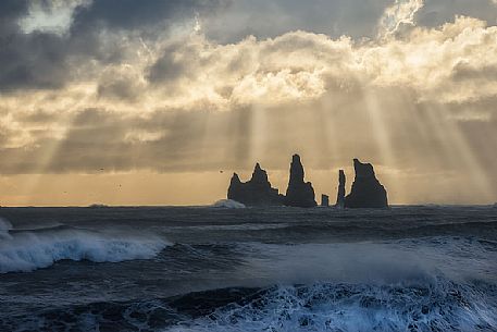 Reynisdrangar cliffs, volcanic rock formations on the coast in the storm, Vik i Myrdal, Iceland