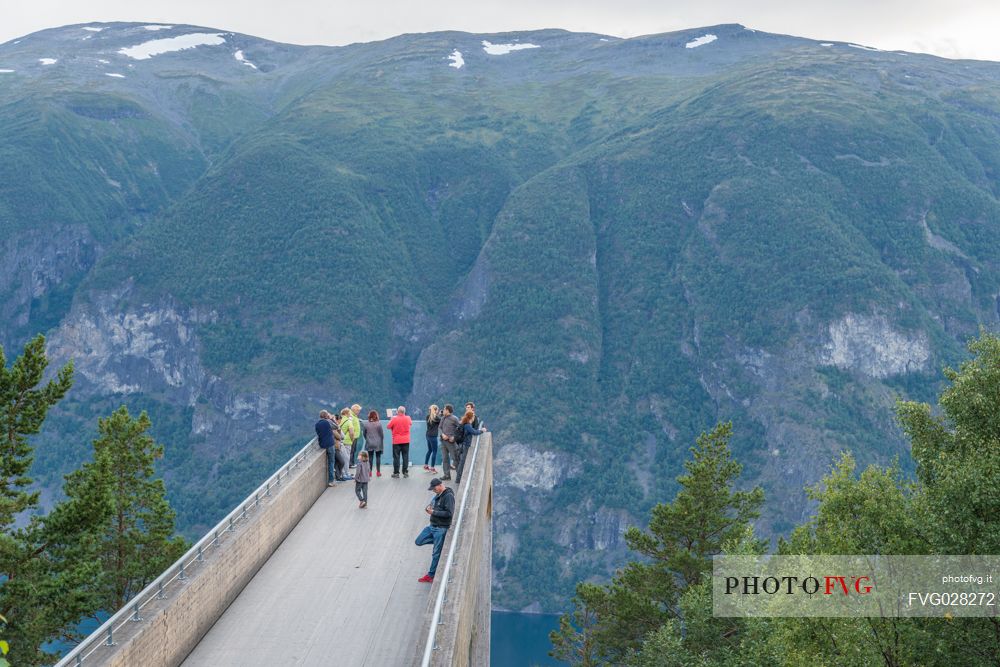 Tourists at the Stegastein looking the Aurlandfjord near Aurland, Sognefjord, Norway