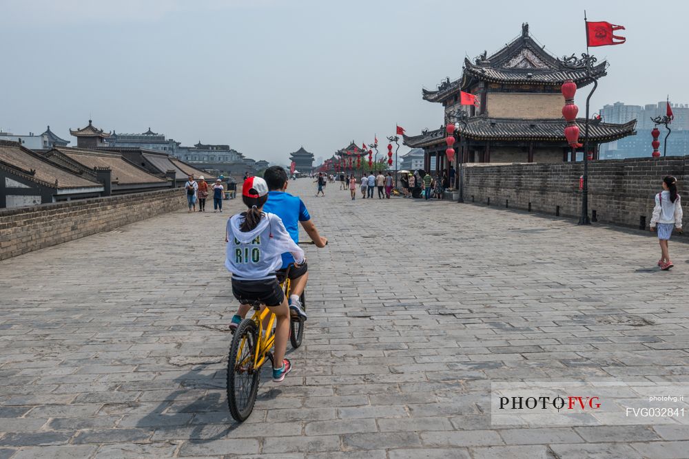 Pedaling along the ancient city wall, Xi'An, Shanxi, China