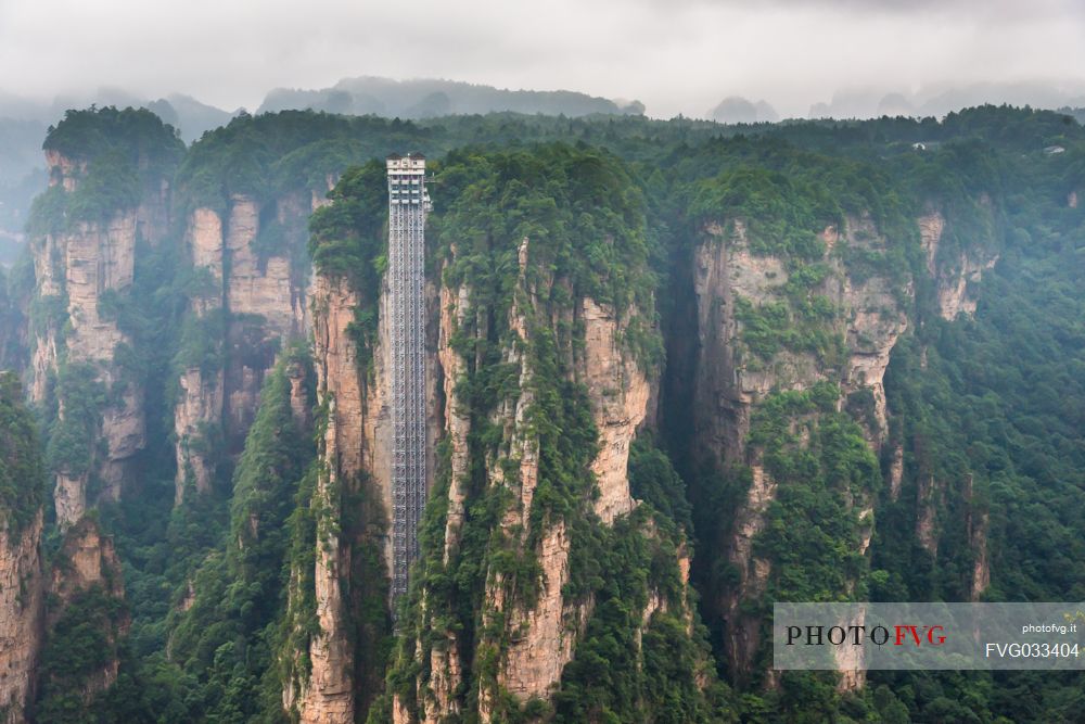 Hallelujah mountains or Avatar mountains ant the Bailong Elevator in the fog, Zhangjiajie National Forest Park, Hunan, China