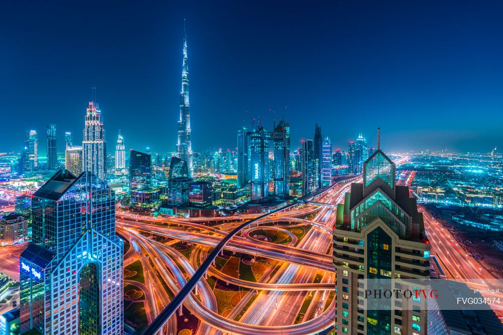 Burj Khalifa and High Rises on Sheikh Zayed Road at twilight, Downtown Dubai, Emirate of Dubai, UAE, Asia