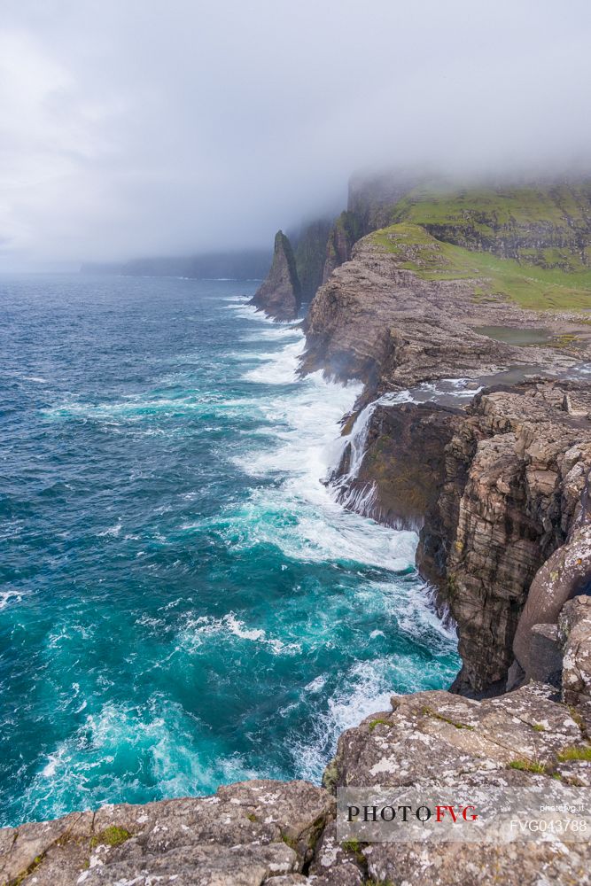 The wild Bsdalafossur waterfall flows from the lake Leitisvatn or Srvgsvatn into the Atlantic ocean, Vgar Island (Vg), Faeroe Islands, Denmark, Europe