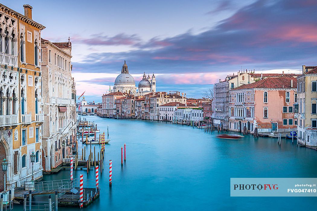 Palazzo Cavalli Franchetti in the Grand Canal and in the background the Santa Maria della Salute church from Accademia bridge at sunset, Venice, Italy, Europe