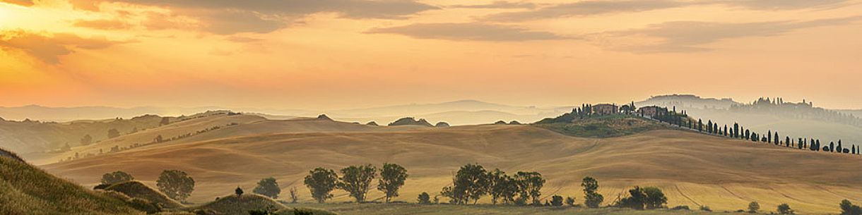 Farm in the Crete Senesi landscape at sunrise, Orcia valley, Tuscany, Italy