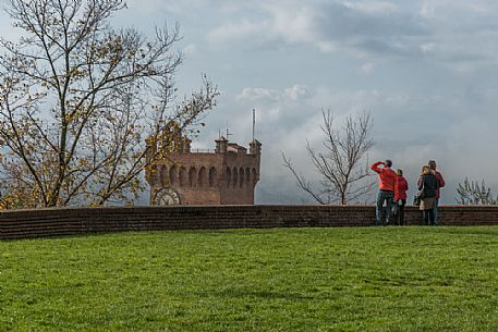 Tourists looking the Torre di Matilde tower form the torre Federico II tower in San Miniato, Tuscany, Italy
