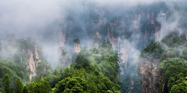 Hallelujah mountains or Avatar mountains ant the Bailong Elevator in the fog, Zhangjiajie National Forest Park, Hunan, China